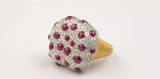 The Bleeding Tooth Ruby ring in 18-karat white and yellow gold is set with unheated Burmese ruby cabochons and diamonds. By Studio Renn