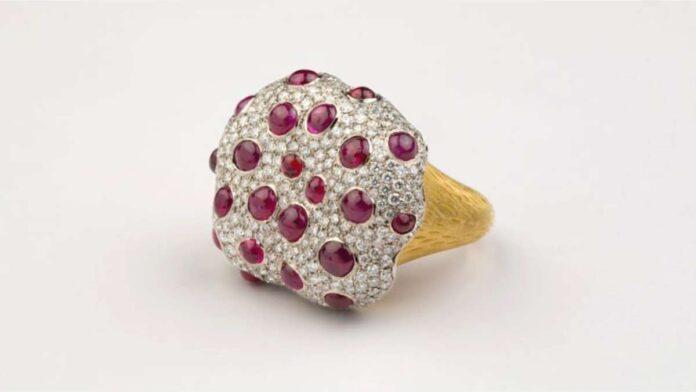 The Bleeding Tooth Ruby ring in 18-karat white and yellow gold is set with unheated Burmese ruby cabochons and diamonds. By Studio Renn